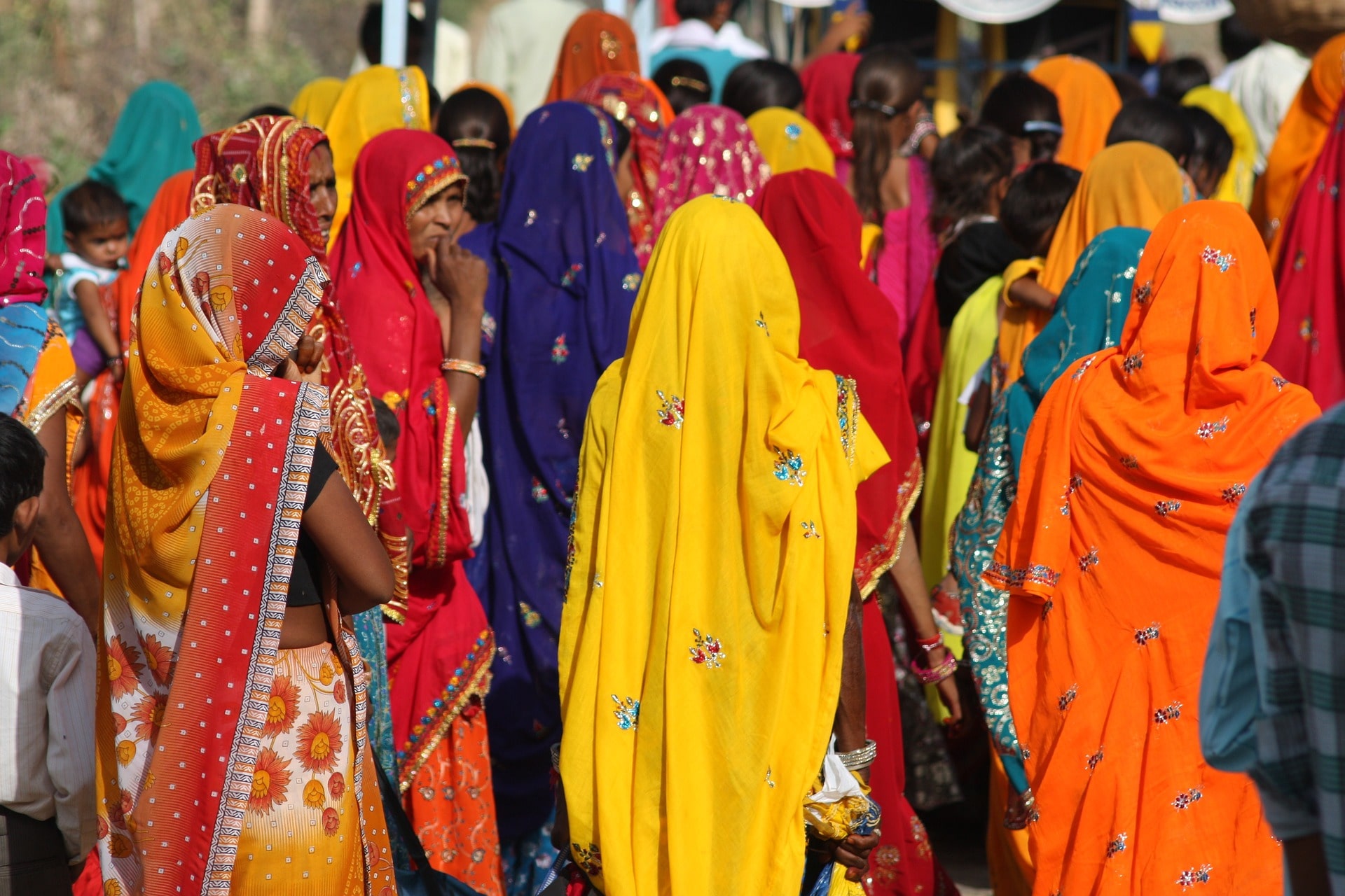 several Indian women with multicolored veils